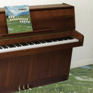 SOPHTWARE SLUMP.....ON A WOODEN PIANO